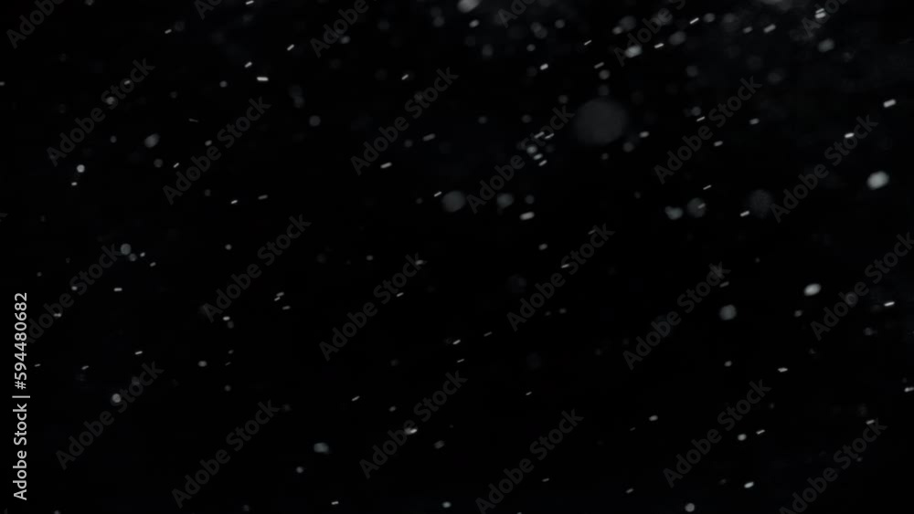 Snow falling slowly sideways to the right in front of a black screen. Isolated overlay. Snow falling slowly sideways to the right in front of a black screen. Isolated overlay.