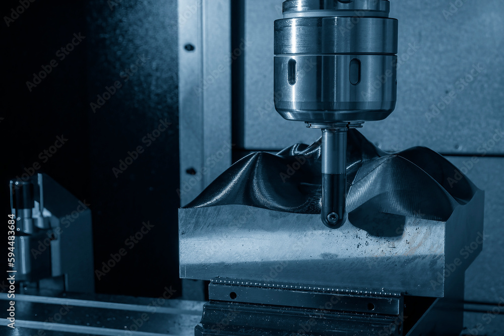Close up scene the CNC milling machine rough cutting the mold parts by indexable ball tools. Close up scene the CNC milling machine rough cutting the mold parts by indexable ball tools.