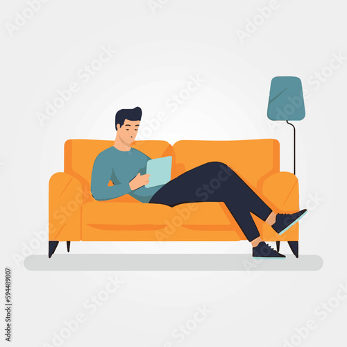 man lying on sofa using cell phone.