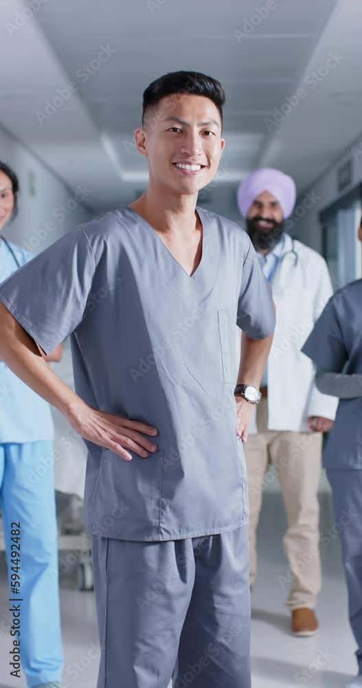 Vertical video of portrait of diverse doctors and nurses looking at camera, in slow motion Vertical video of portrait of diverse doctors and nurses looking at camera, in slow motion
