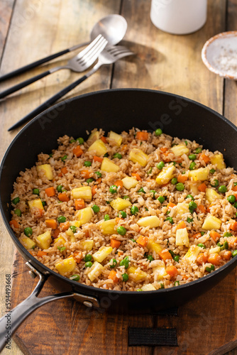 Pineapple fried rice with peas and carrots