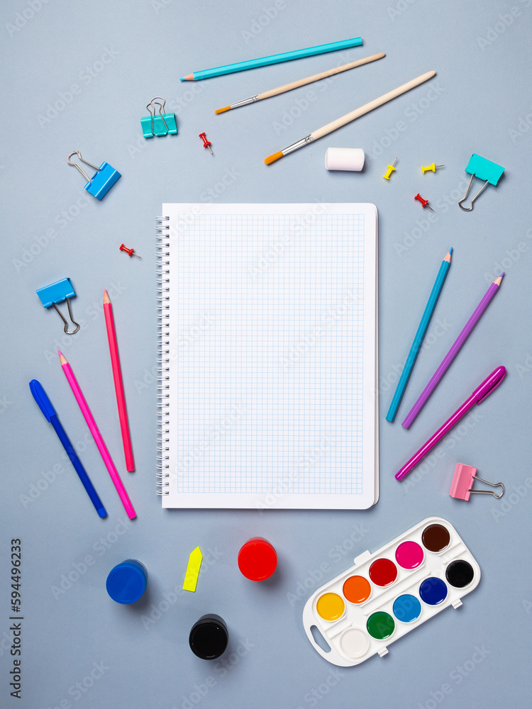 Top view of a flat work desk lies a notebook with blank sheets and stationery. Template for women's blogs in social networks Top view of a flat work desk lies a notebook with blank sheets and stationery. Template for women's blogs in social networks