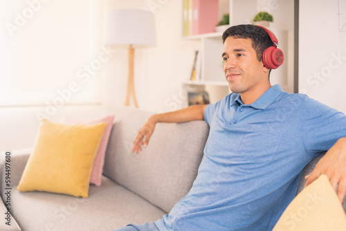 Relaxed man listening to music at home