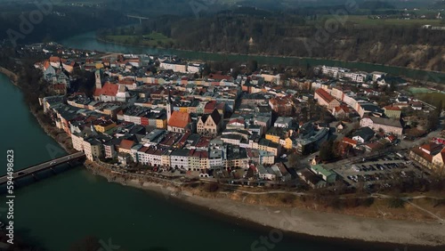 Wasserburg am Inn, old medieval town in Bavaria, Germany, surrounded by green river bend. Aerial drone footage of European houses, castle, bridge, church and market square in early morning fog. 4K UHD photo
