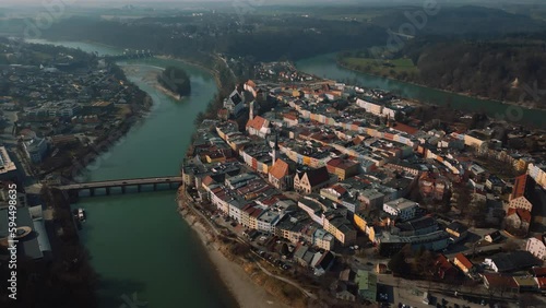 Wasserburg am Inn, medieval old town in Bavaria, Germany, surrounded by green river bend. Aerial drone footage of European houses, castle, bridge, church and market square in early morning fog. 4K UHD photo
