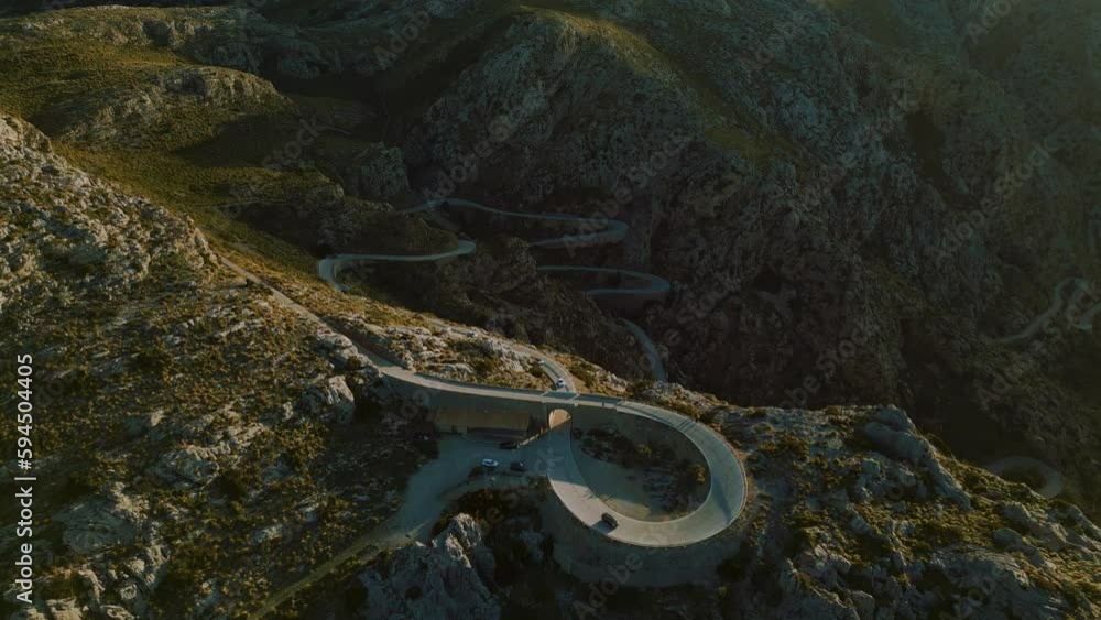 Hairpin Bend Sa Calobra at Palma de Mallorca Island. Serpentine curve road in the mountains near Soller. Scenic Majorca nature aerial drone footage. Famous for racing bikes cycling. Cinematic 4K UHD. Hairpin Bend Sa Calobra at Palma de Mallorca Island. Serpentine curve road in the mountains near Soller. Scenic Majorca nature aerial drone footage. Famous for racing bikes cycling. Cinematic 4K UHD.