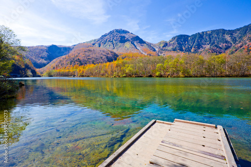 Fototapeta Naklejka Na Ścianę i Meble -  Taisho Pond has a beautiful surface which reflects the Hotaka Mountains, and with surrounding scenery symbolizing of Kamikochi national park.