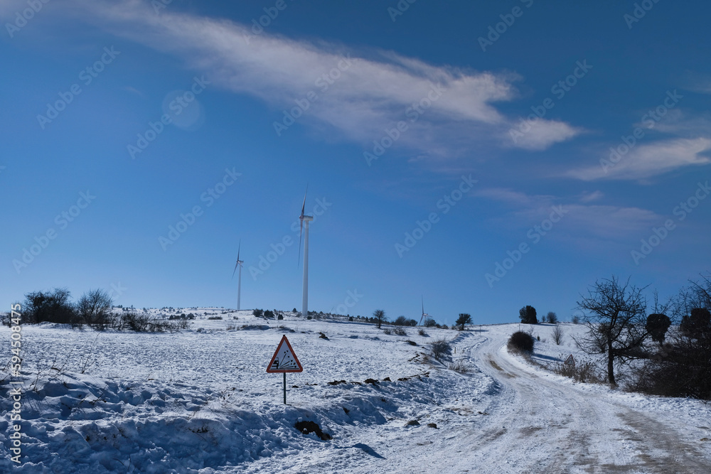 wind turbine on a snowy day