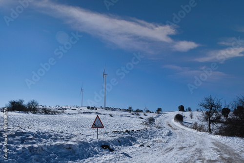 wind turbine on a snowy day © scetin