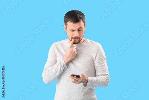 Handsome man with mobile ph...