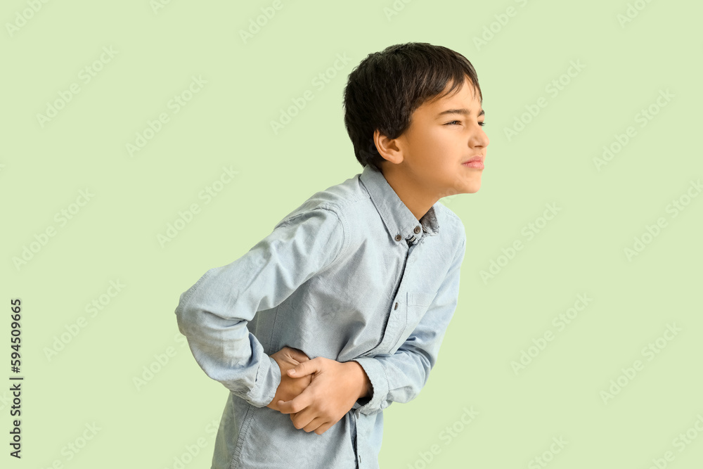 Little boy with appendicitis on green background Little boy with appendicitis on green background