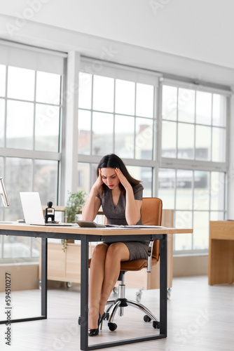 Stressed female accountant ...
