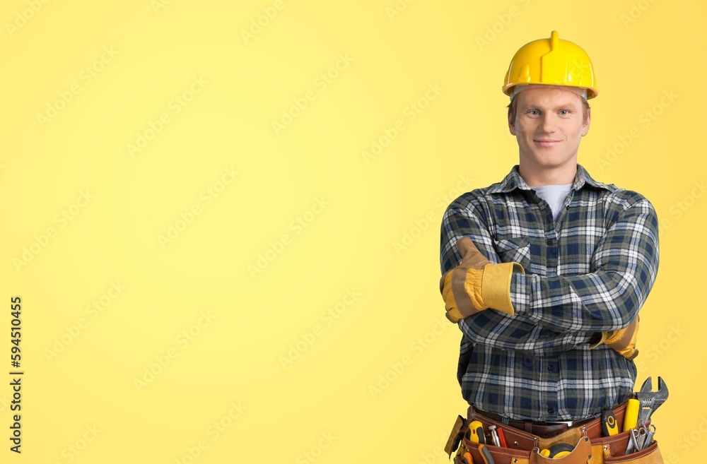 Young electrician man posing on background Young electrician man posing on background