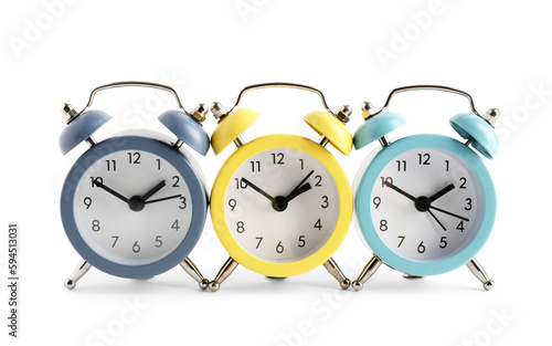 Three colorful alarm clocks...