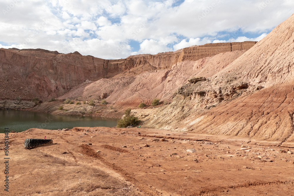 Road  leading down to the deep blue Hidden Lake near the Timna park,surrounded by mountains near Eilat city, Arava Valley, southern Israel