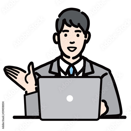 ラップトップの前で笑顔で説明をしているスーツを着た若い男性
