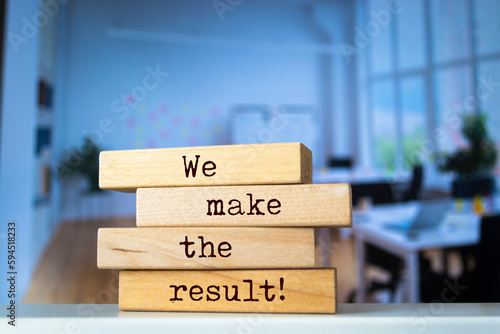 Wooden blocks with words 'We make the result'. Business concept