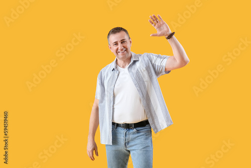 Mature man giving high-five...