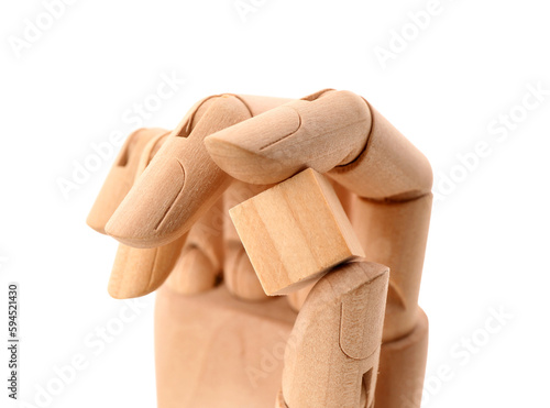 Wooden hand with cube isolated on white background