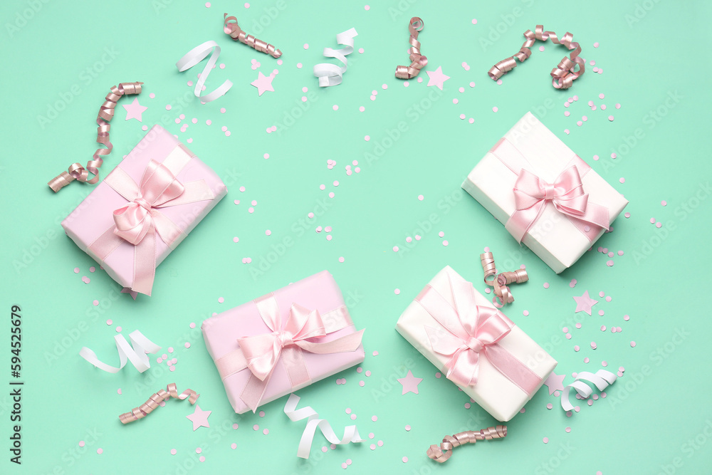 Frame made of gift boxes with bows, serpentine and confetti on turquoise background Frame made of gift boxes with bows, serpentine and confetti on turquoise background