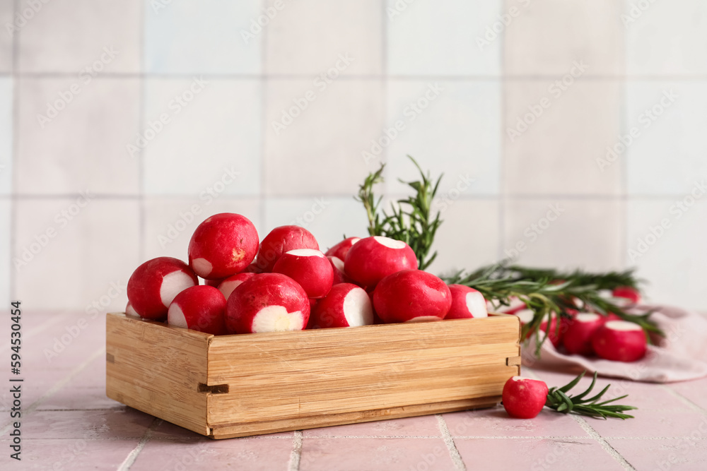 Wooden box with fresh radish on table Wooden box with fresh radish on table