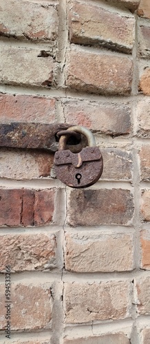  old rusty lock on the wall