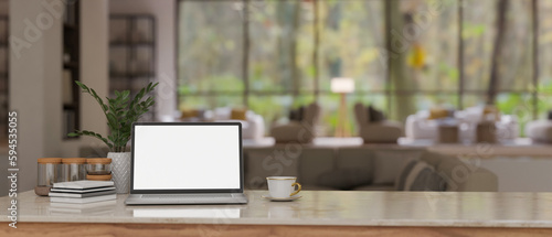 Wallpaper Mural Workspace with laptop mockup on a table over blurred background of a modern lounge with sofa. Torontodigital.ca