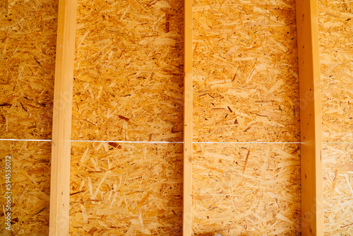 OSB is a building material made of wood chips and resin. photo