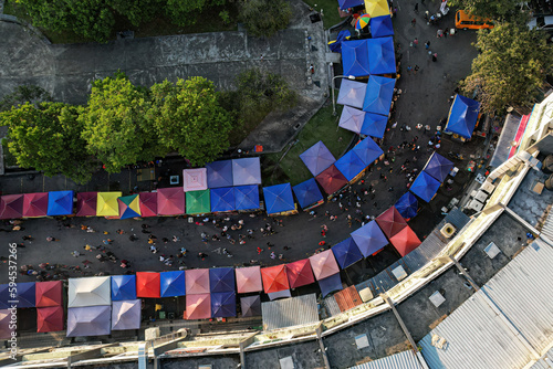 Aerial top down view of A stretch of stalls at a ramadhan bazaar in Bandar Seri Putra, Selangor. The bazaar is a famous market offering varied Malay food for iftar or buka puasa.
