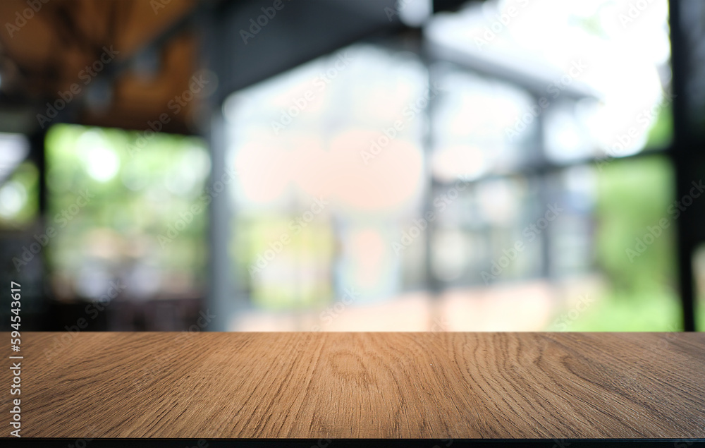 Empty dark wooden table in front of abstract blurred bokeh background of restaurant . can be used for display or montage your products.Mock up for space. Empty dark wooden table in front of abstract blurred bokeh background of restaurant . can be used for display or montage your products.Mock up for space.