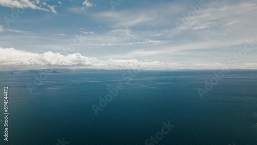 Wallpaper Mural Stunning drone footage captures the breathtaking beauty of the vast and serene Titicaca Lake, showcasing its shimmering blue waters from above. Torontodigital.ca