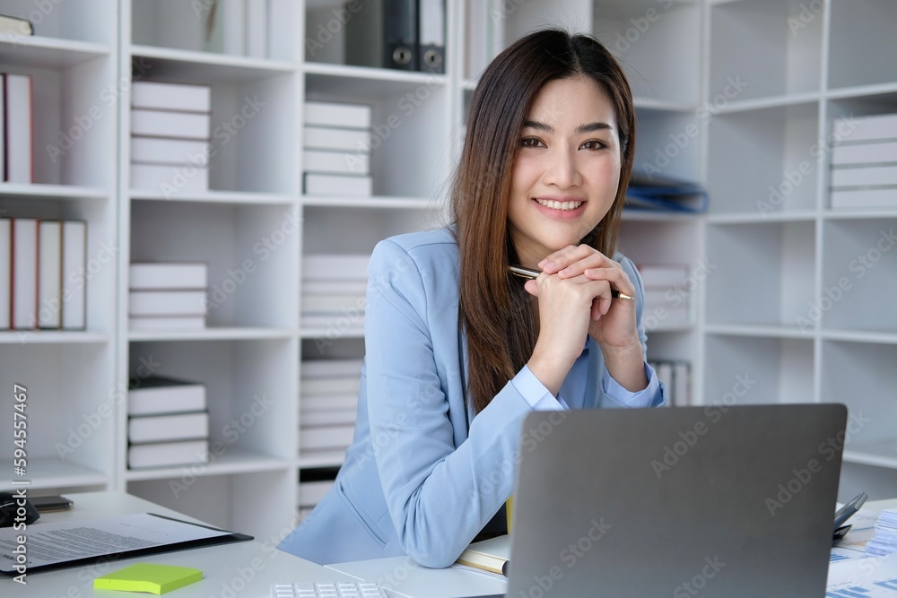 Smiling businesswoman working at laptop Smiling businesswoman working at laptop