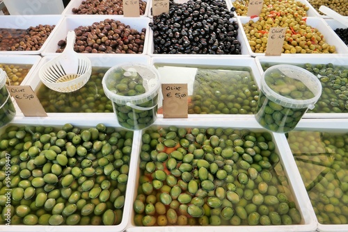 ITALY CANOSA DI PUGLIA APRIL 20 2023 VARIOUS TYPES OF APULIAN OLIVES ON DISPLAY IN A A LOCAL MARKET