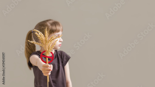 Girl holding crossed spikelet symbol gluten free food. Banner international day of celiac. photo