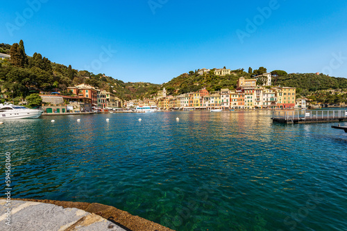 Port of the famous village of Portofino, luxury tourist resort in Genoa province, Liguria, Italy, Europe. Port and colorful houses, Mediterranean sea (Ligurian sea).