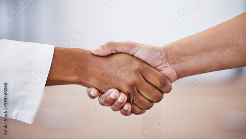 Doctor, handshake and meeting in thank you for healthcare, agreement or deal at hospital. Medical professional shaking hands with patient for healthy wellness, consultation or partnership at clinic
