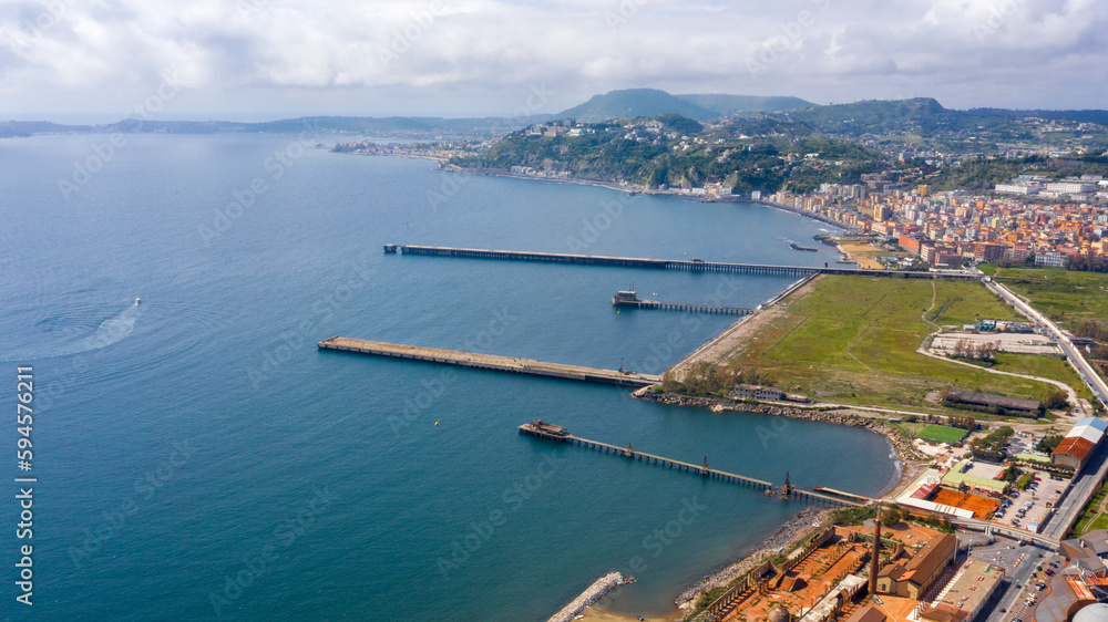 Aerial view of the ex Italsider area of Bagnoli from the Posillipo hill, in the metropolitan city of Naples, Campania, Italy. It's a disused industrial complex on the coast of Mediterranean sea.