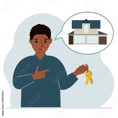A man holds the keys to the house, and in his thoughts a beautiful house. The concept of buying, renting, selling real estate.