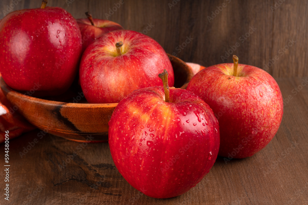Red apple fruit isolated on wooden background Red apple fruit isolated on wooden background