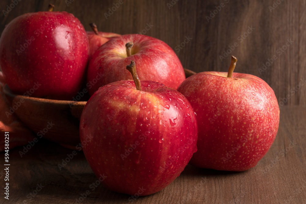 Red apple fruit isolated on wooden background Red apple fruit isolated on wooden background