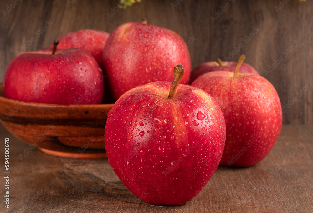 Red apple fruit isolated on wooden background Red apple fruit isolated on wooden background