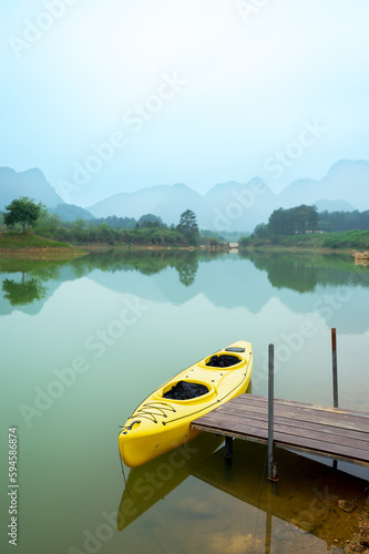 The lake and mountains  there is a kayak by the river