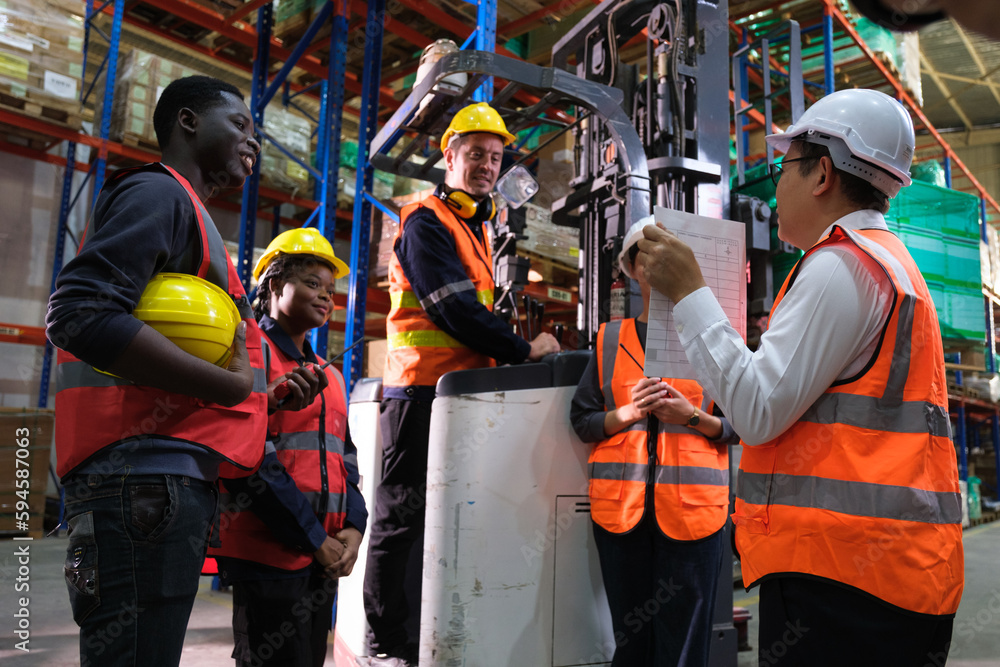 Group of Industrial workers working at a warehouse factory. Group of Industrial workers working at a warehouse factory.