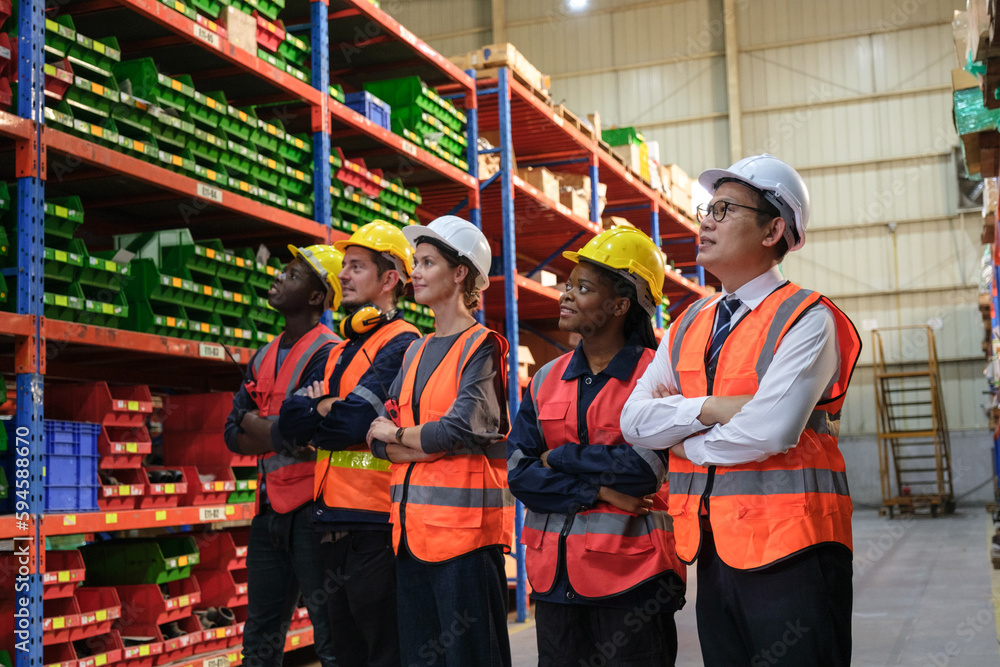 Group of Industrial workers working at a warehouse factory. Group of Industrial workers working at a warehouse factory.
