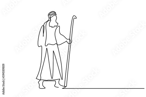 bearded man in old arab suit walks with scepter stick