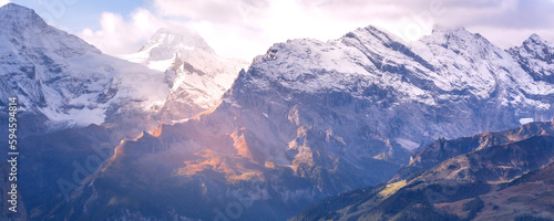 Panoramic banner view of Swiss Alps, Jungfraujoch, peaks first snow, Bernese Oberland, Switzerland