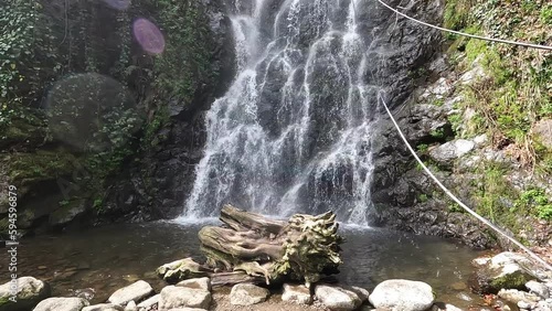 Water flows in the famous Mirveti Waterfall, which is in the forest near to Batumi - Georgia photo