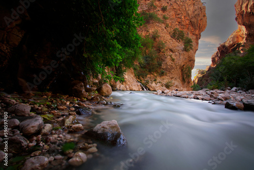 The scenic view of Saklıkent canyon, 300 m deep and 18 km long, being one of the deepest in the world, formed through abrasion of the rocks by flowing waters over thousands of years in Turkey photo