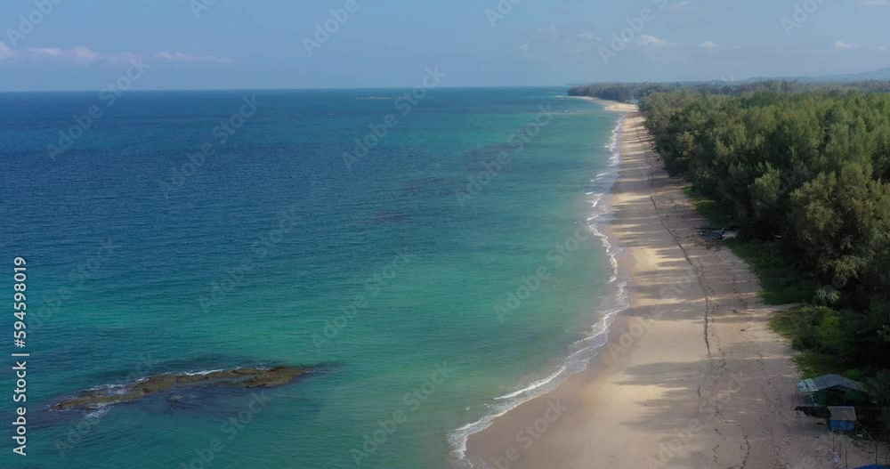 Drone video of deserted Natai beach in Thailand during the day with white sand and turquoise blue water Drone video of deserted Natai beach in Thailand during the day with white sand and turquoise blue water