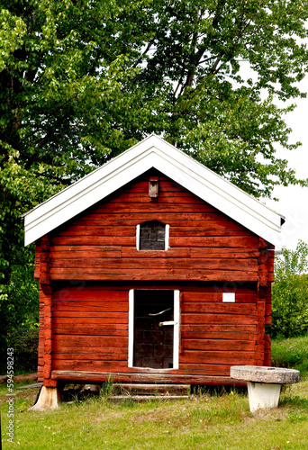 Old wooden red  cottage in dalecarlia in Sweden photo